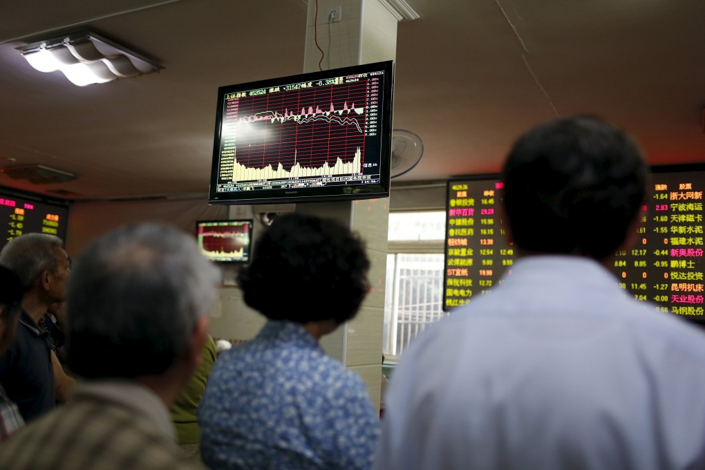 Chinese investors eye prices on the Shanghai stock market as the Vanguard Group in the US announced it was adding China A-shares to their emerging market ETF. Vanguard is one of the biggest ETF providers in the world. Photo: Reuters