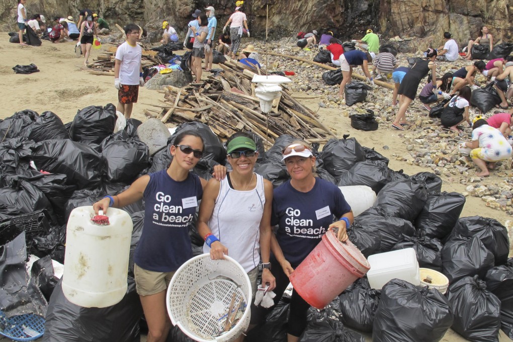 Nissa Marion (left) and Lisa Christensen (right) at a beach cleanup.