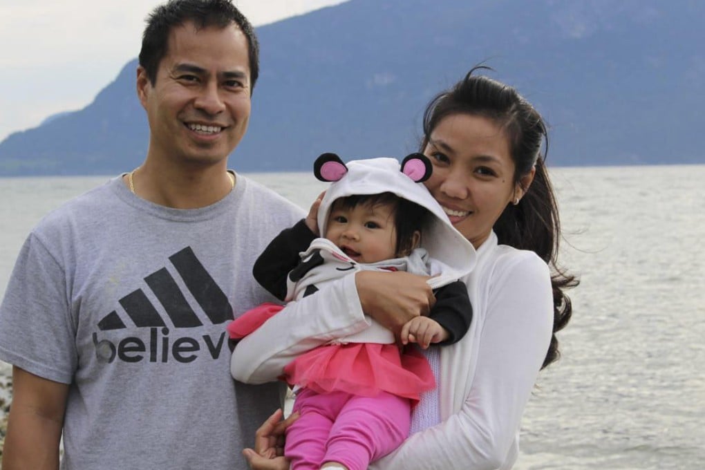 Harry Yung with his wife, Thu, and their baby, Jessica, in Vancouver. Photo: Petti Fong