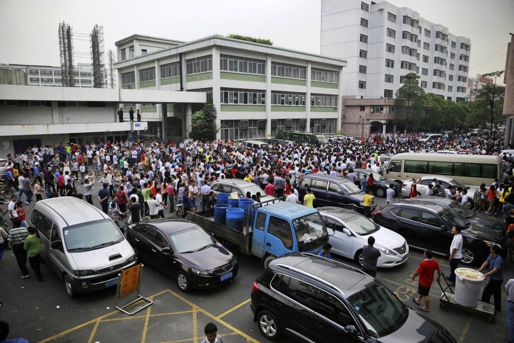 Shoe workers strike in Dongguan. Grass-roots NGOs involved in sensitive areas such as labour rights might struggle to survive under a proposed new law, experts say. Photo: Reuters