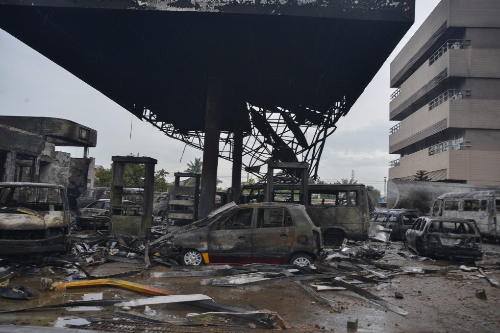 Destroyed vehicles at the scene of a petrol station fire in Accra, Ghana. Photo: EPA