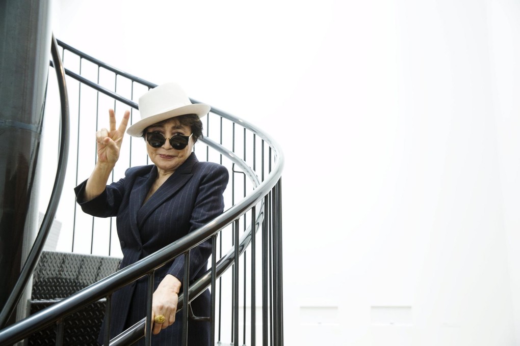 Yoko Ono  stands on her artwork,To See the Sky, at MoMA. Photos: Reuters, EPA