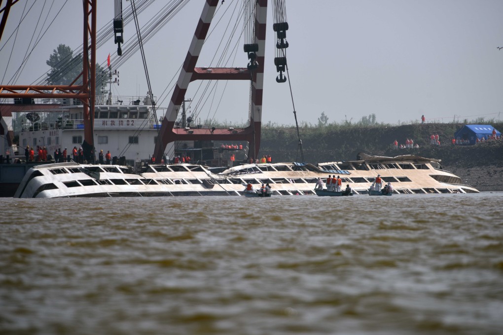 The sunken cruise ship Eastern Star is brought to the surface in the Jianli section of the Yangtze River in Hubei province. Photo: Xinhua