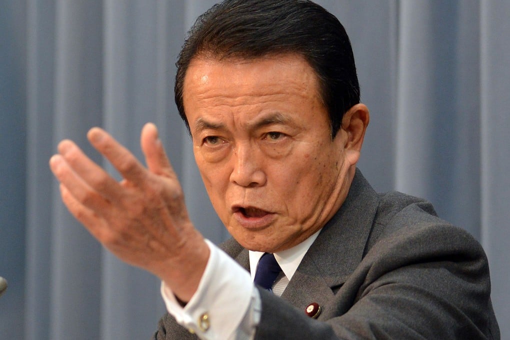 Taro Aso is due to meet senior officials, including Finance Minister Lou Jiwei. Photo: AFP
