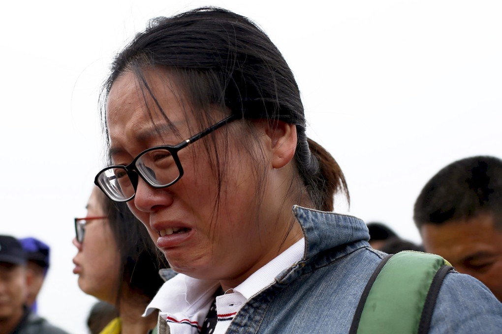 A relative of a missing passenger aboard a capsized ship cries. Photo: Reuters