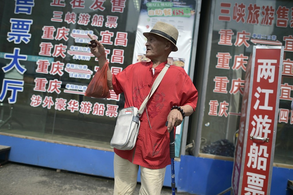A man outside a travel agency in Chongqing. The number of senior tourists rose 58 per cent last year from 2013.Photo: AP