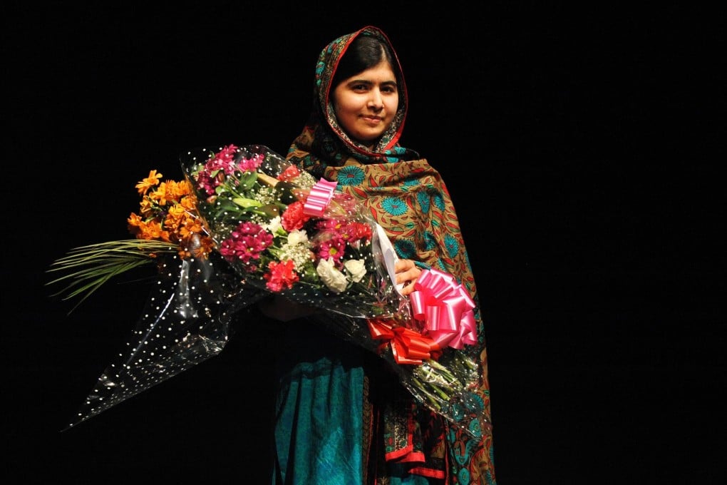Malala Yousafzai poses with flowers in England.Photo: AP