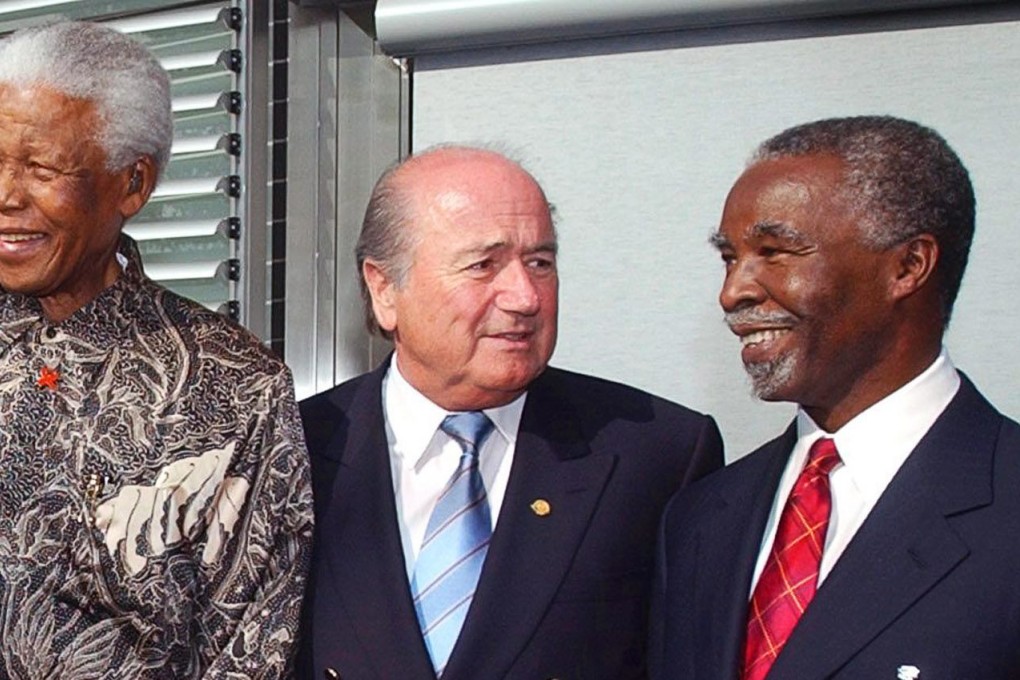 Then-president of South Africa Thabo Mbeki (right) with Sepp Blatter and former president Nelson Mandela in 2004. Photo: EPA