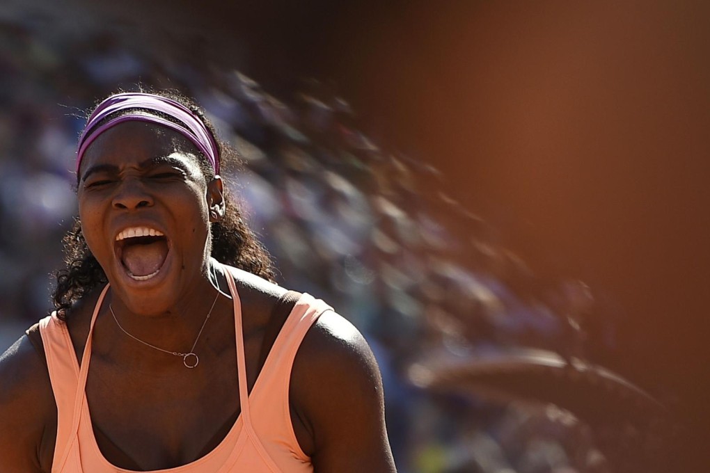 Serena Williams screams in delight after winning the French Open women's singles final at Roland Garros. Photo: AFP