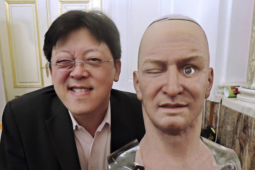 Hanson Robotics CEO Jong Lee poses with his firm's intelligent robot head called Han at the Pioneers Festival in Vienna, Austria. Photo: Vivienne Chow