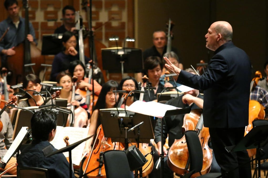 Van Zweden puts the players through their paces at a recent rehearsal. Photo: Nora Tam