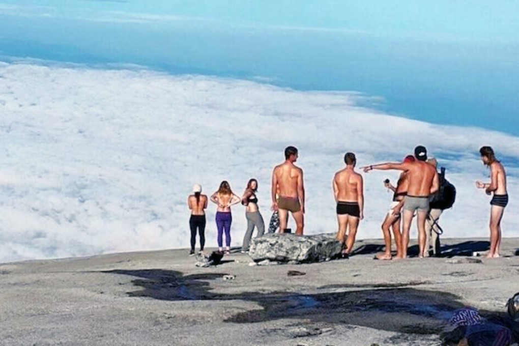 Climber who posed for controversial naked pictures on Malaysia's