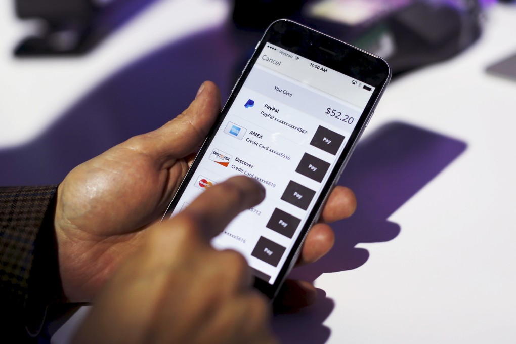 A payment is made on a demonstration Paypal device in San Francisco. Jetco is working to bring similar mobile payment solutions to Hong Kong. Photo: Reuters
