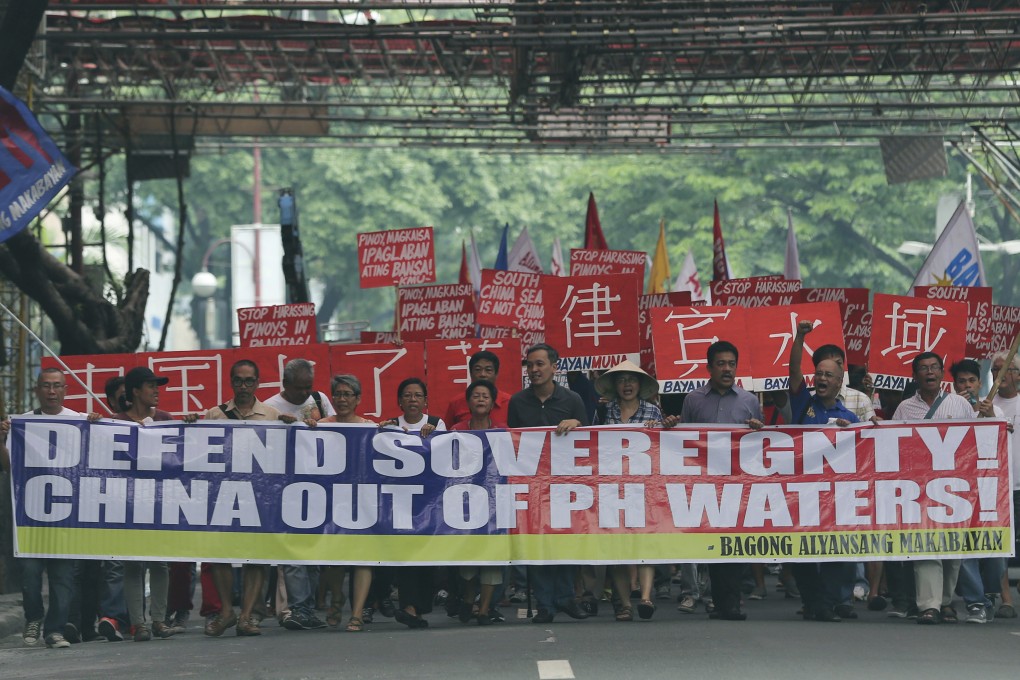 Filipino activists protesting against China's actions in the South China Sea, at a march in Manila last week. Photo: AP
