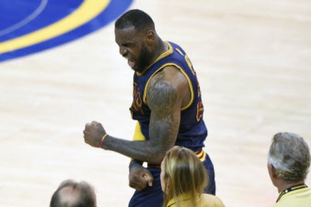 LeBron James pumps his fist in celebration after Cleveland Cavaliers win game two of the NBA Finals against Golden State Warriors. Photos: USA Today Sports