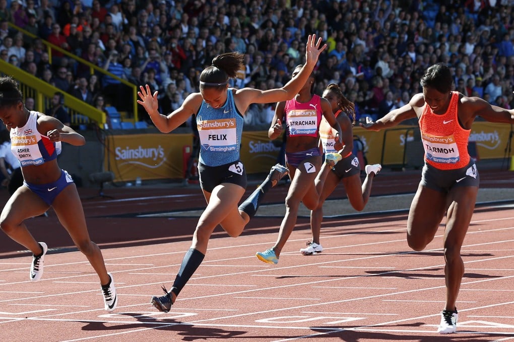 Jeneba Tarmoh (right) wins the 100 metres from  Allyson Felix (centre). Photo: Reuters