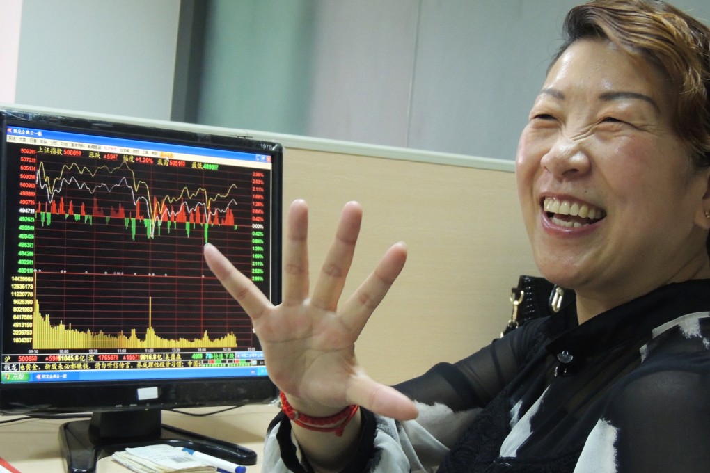 A Chinese investor smiles broadly as share prices go up. A study urged that people should concentrate on savings when they are young and then look at asset allocation as they get older. Photo: Xinhua