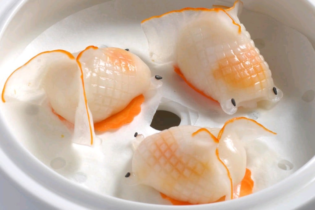 Steamed crystal blue shrimp dumplings shaped like goldfish at The Eight