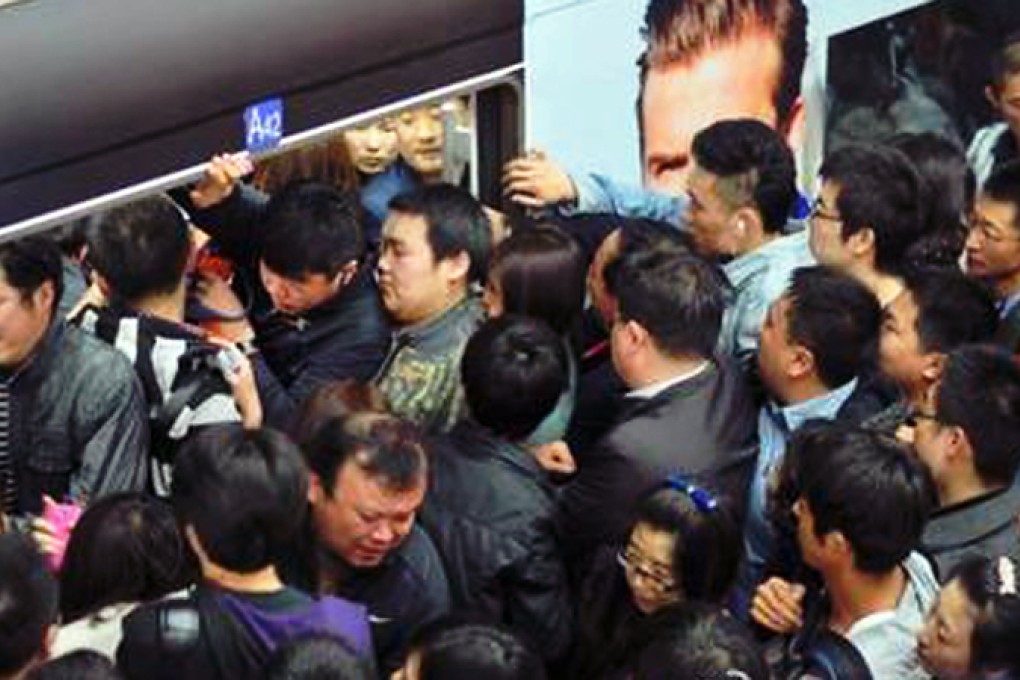 Beijing's subway system is notoriously crowded during peak hours. FILE Photo