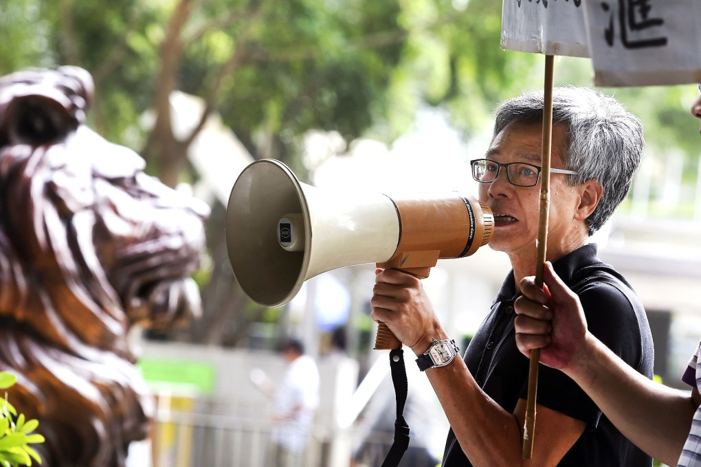 Lee Kwok-keung, Chairman of Hong Kong & Kowloon Trades Union Council, protests at the Headquarter of HSBC. Photo: Sam Tsang