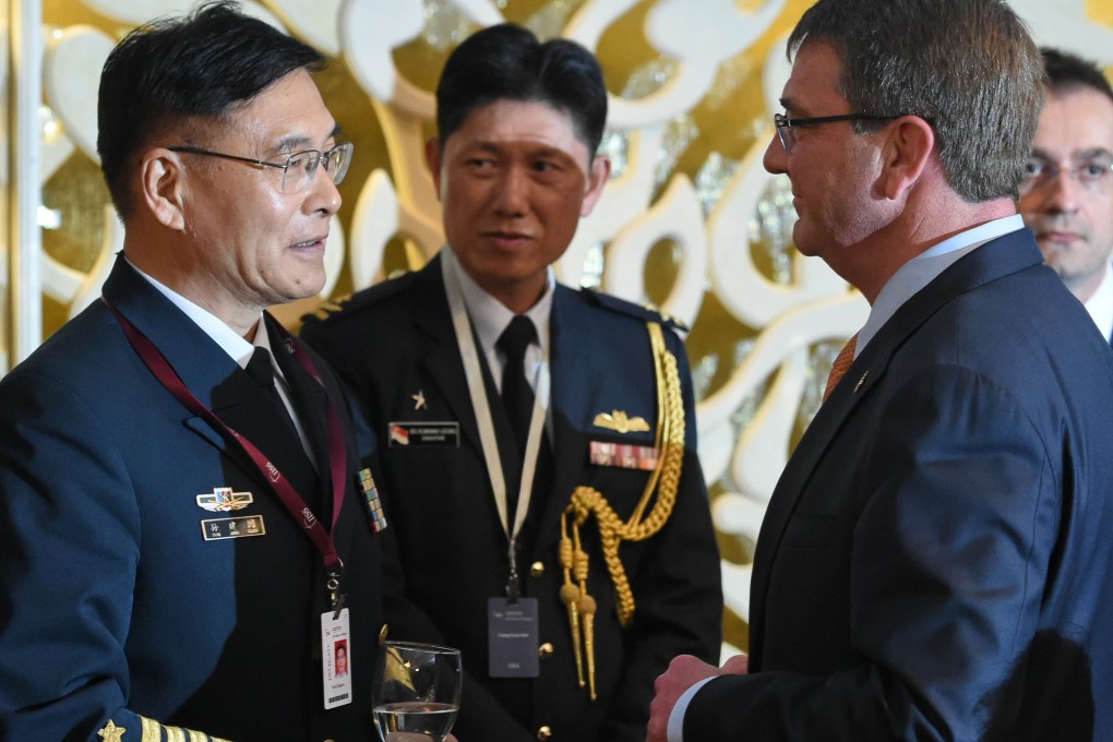 Admiral Sun Jianguo chats with US Secretary of Defence Ashton Carter during the ministerial luncheon at the  Shangri-La Dialogue in Singapore. Photo: AFP