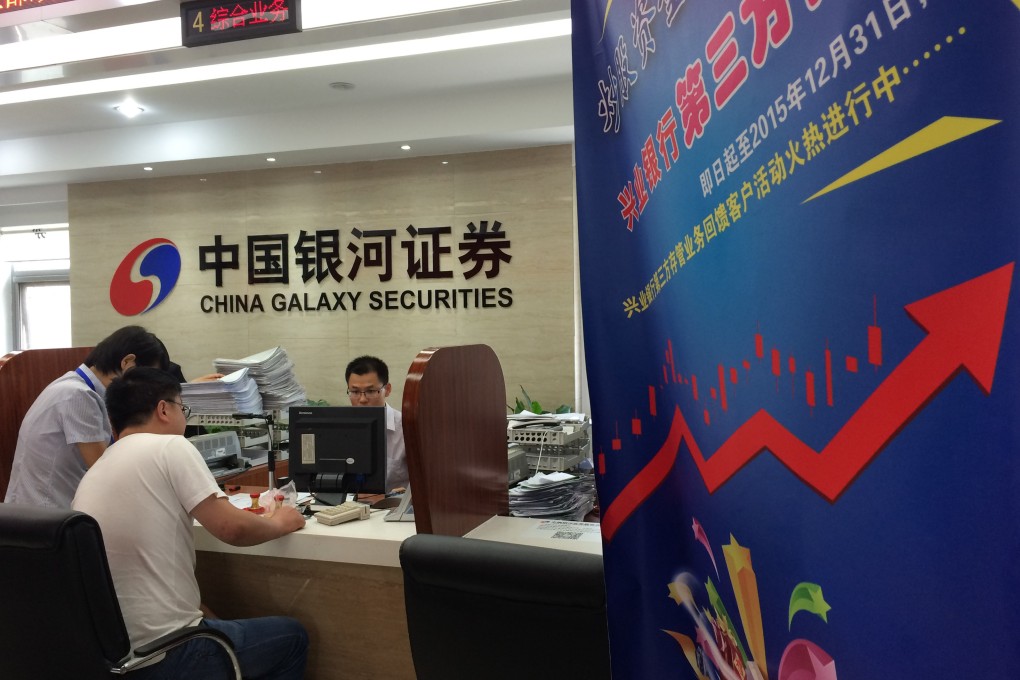 Chinese investors sign up to open new accounts to buy shares in the country's surging stock markets as a debate erupts over a bubble in equities. Photo: Xinhua