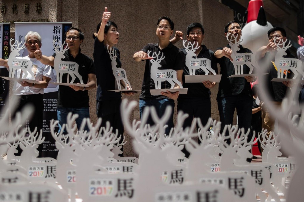 Pan-democrat lawmakers give the electoral proposal the thumbs down. Photo: AFP