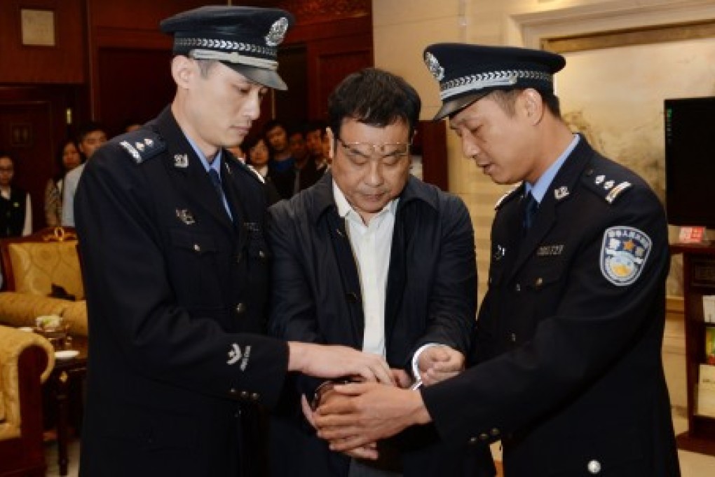 China's former official Li Huabo, who is accused of fraud, was caught in Singapore and arrested upon arrival in Beijing in May. Photo: Xinhua