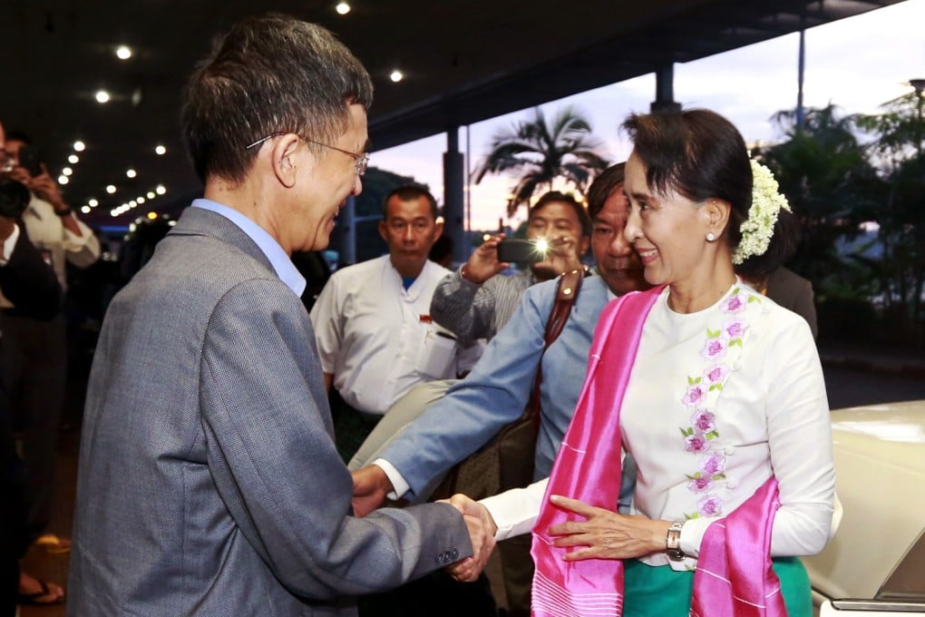 Aung San Suu Kyi is seen off at Yangon Aiport by China's ambassador to Myanmar. Photo: SCMP Pictures