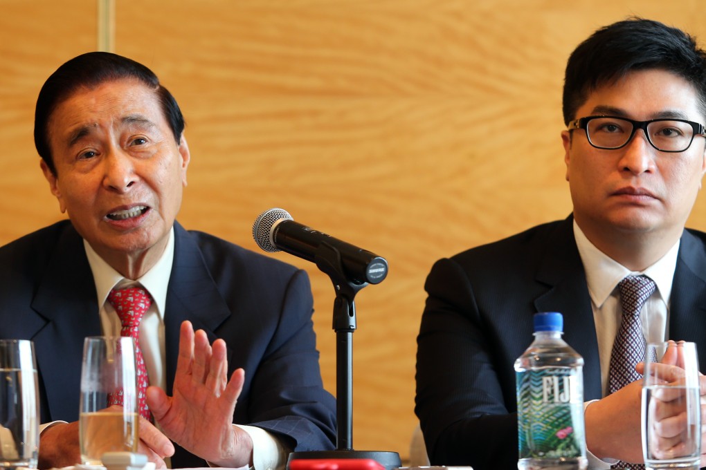 Lee Shau-kee, with his son Martin Lee, says the price gap between mass and luxury homes is narrowing. Photo: Sam Tsang