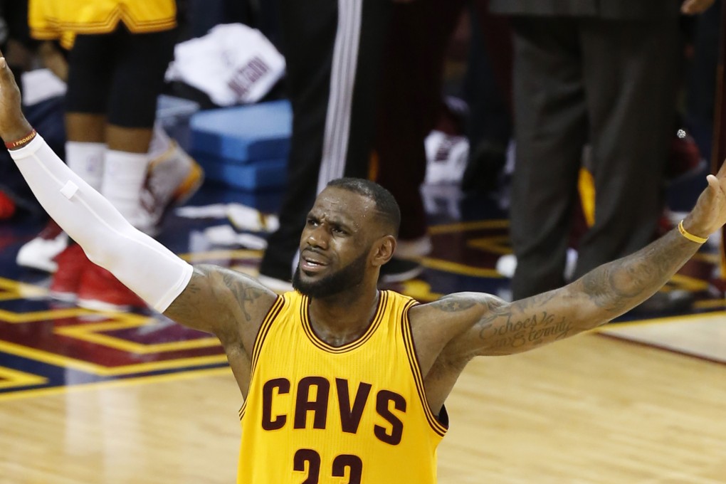 LeBron James urges on the crowd. Photo: AP
