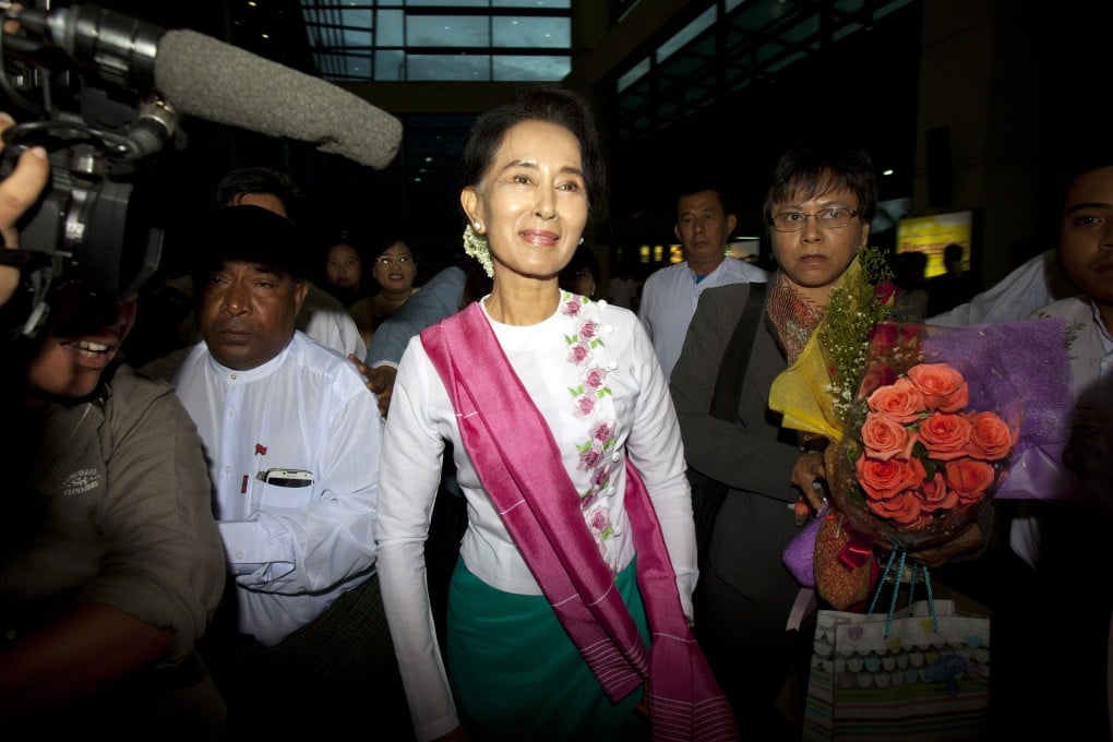 Myanmar's opposition leader Aung San Suu Kyi (centre) is making a five-day trip to China. Photo: AP