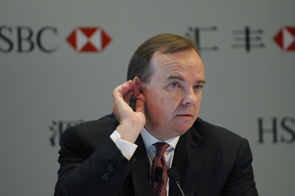 HSBC chief Stuart Gulliver cocks his ears to listen at a press conference as the bank will need a good leader to get through the next few years. Photo: AP