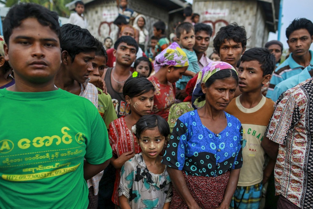 Rohingya Muslims gather at a refugee camp outside Sittwe, Myanmar. Phuket news website editor Alan Morison and reporter Chutima Sidasathian, who have been covering the Rohingya story for years, face two years in jail if found guilty. Photo: Reuters