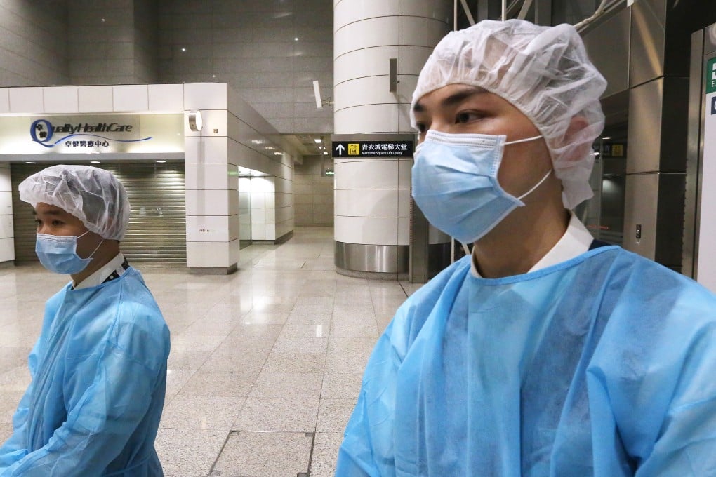 Health officials in protective clothing investigate at the Quality HealthCare Medical Centre in Tsing Yi train station. Photo: Sam Tsang