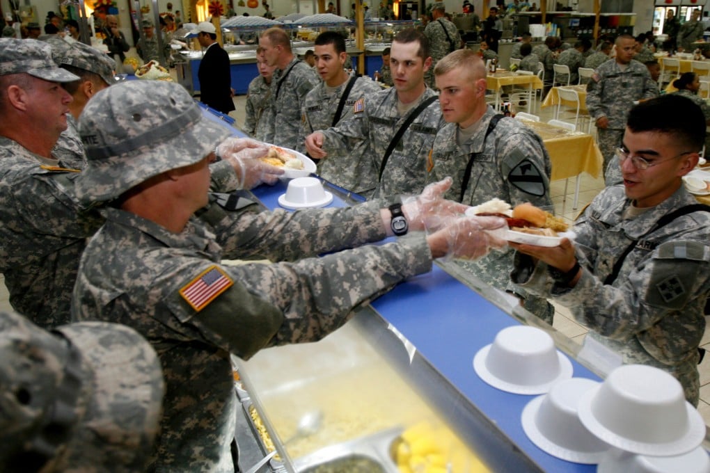 A treat: US soldiers get served turkey on Thanksgiving in this file picture. Photo: AP