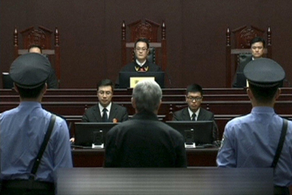 Zhou Yongkang listens as his sentence is read. Photo: Reuters