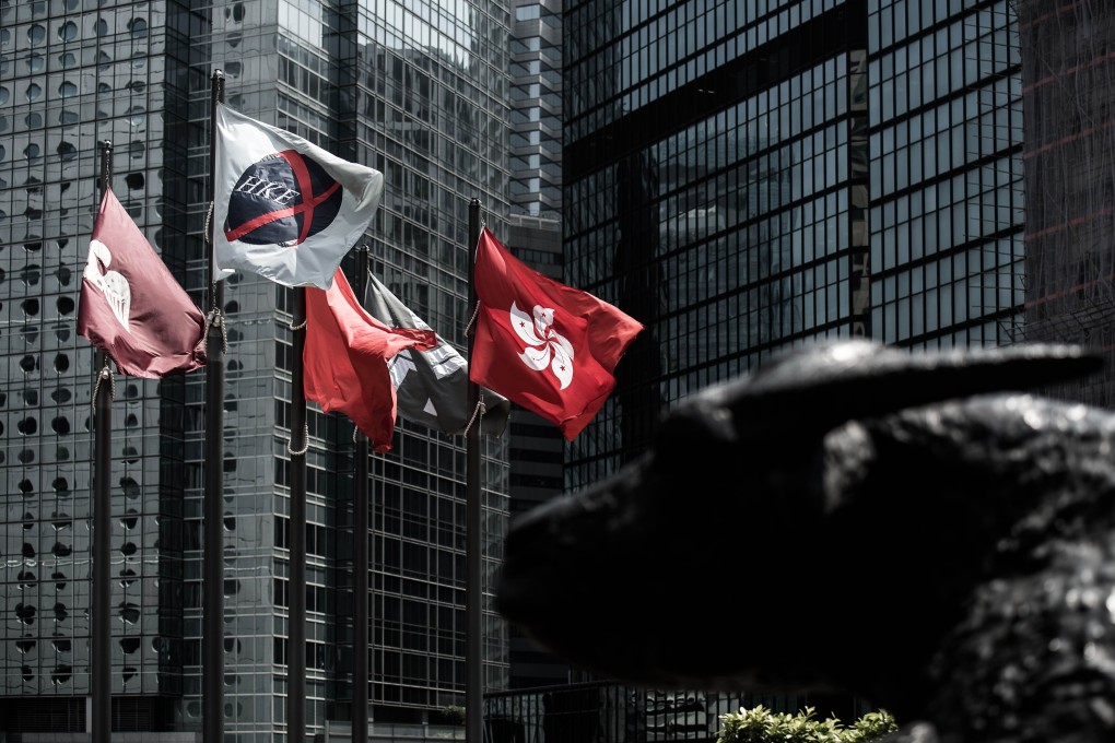 The banner of Hong Kong Exchanges and Clearing flutters in the city. CY Foundation's majority shareholder sold shares and convertible notes in the company. Photo: AFP