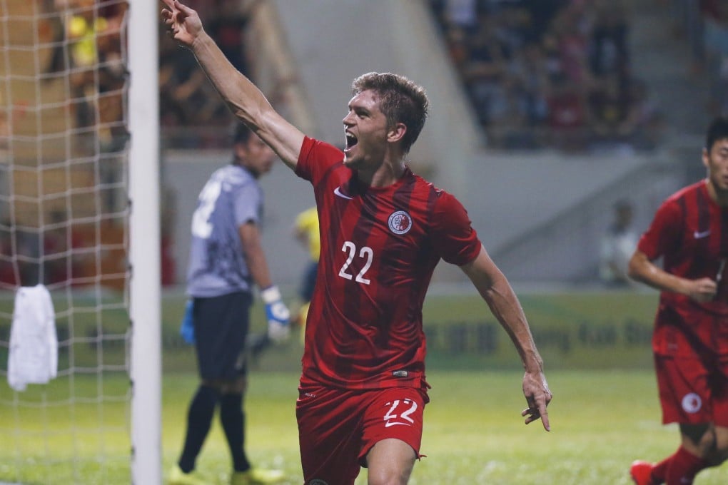 Jaimes McKee celebrates after scored against Bhutan in their World Cup Asian qualifier at Mong Kong Stadium. Hong Kong won 7-0. Photo: AP