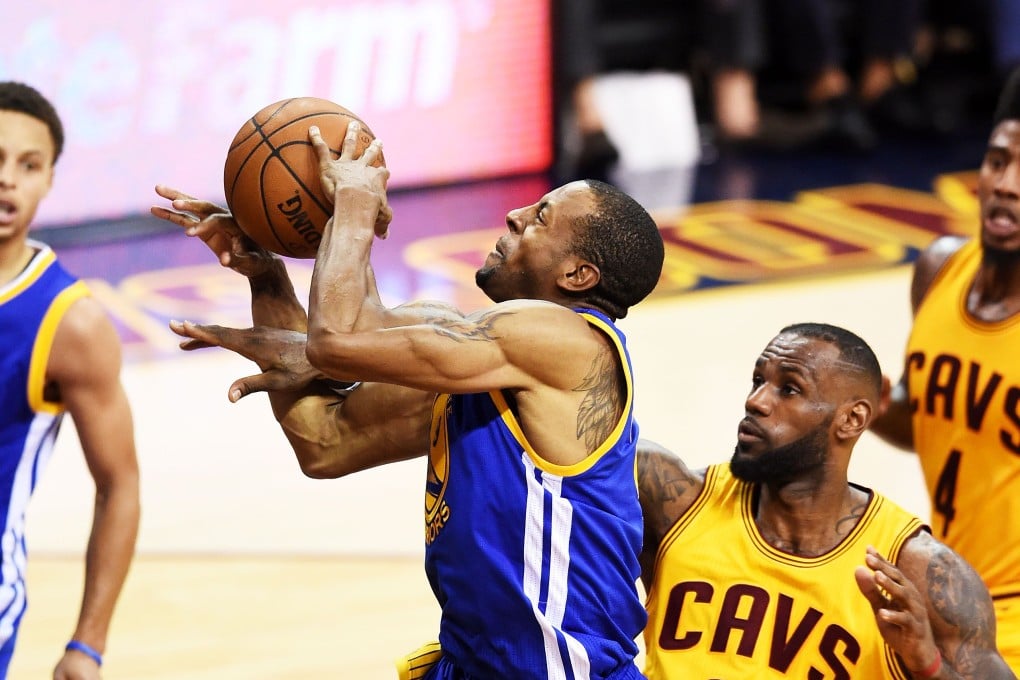 Andre Iguodala  goes up against LeBron James  in the third quarter. Photo: AFP