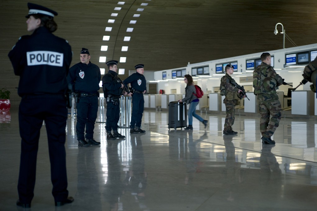 Police at Charles de Gaulle Airport in Paris during a time of heightened security in January this year. Photo: AFP