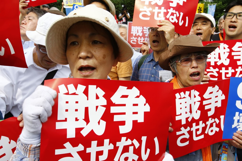 About 25,000 protesters gather outside the parliament building in Tokyo to oppose a set of controversial bills intended to expand Japan’s defense role. Photo: AP