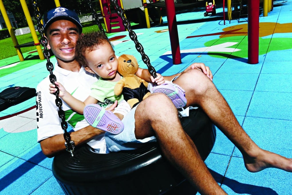 Joao Moreira relaxes with his daughter, Marina, at home in Sha Tin. Photo: Jonathan Wong