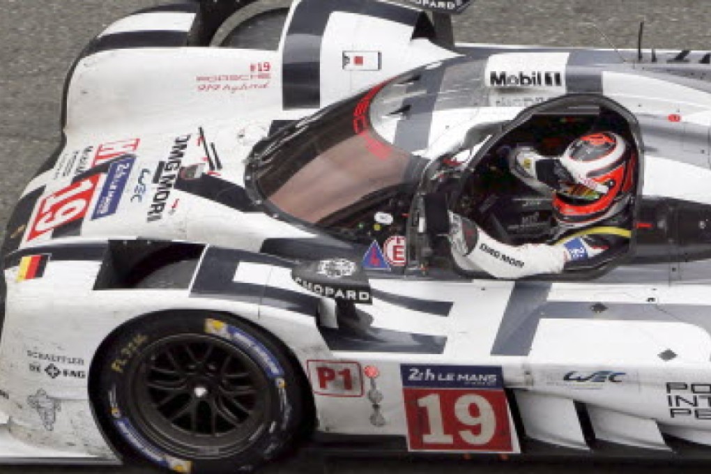 Germany's Nico Hulkenberg celebrates after the Porsche No 19 wins the Le Mans 24 Hours race. Photos: Reuters