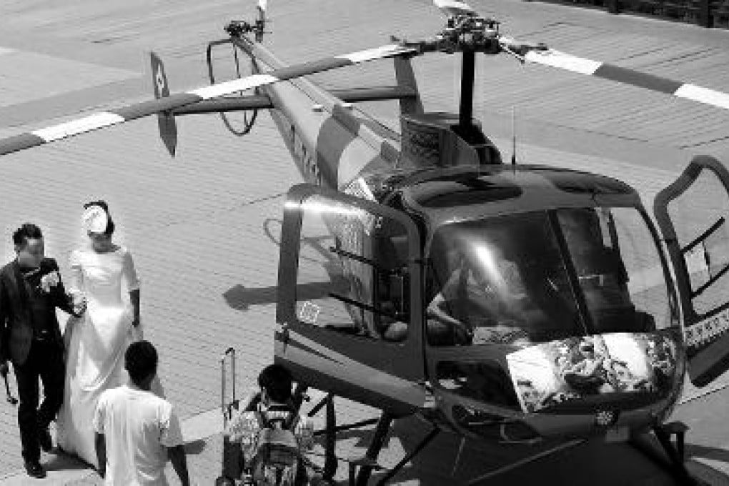 A couple from Xian tied the knot 400m above the city in a helicopter. Photo: Weibo