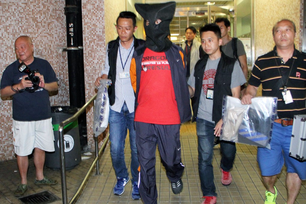 Police detain the autistic man. Photo: SCMP Pictures