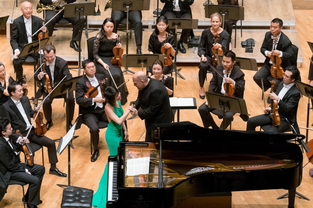 Jaap van Zweden congratulates Yuja Wang on her performance.