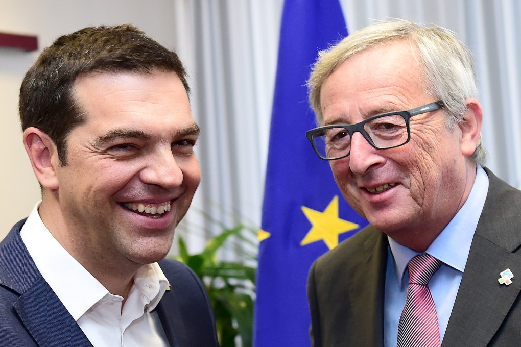 Greek Prime Minister Alexis Tsipras poses with European Commission President Jean-Claude Juncker (R) as an International Monetary Fund economist said a deal with the country will be tough on both sides. Photo: Reuters