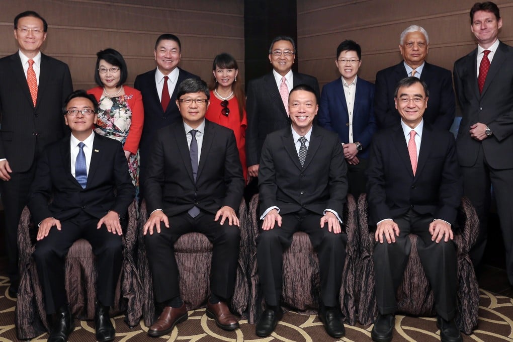 The judges for the awards include (seated, from left) Kenneth Chen, the divisional president for Greater China of CPA Australia; Robin Hu, the chief executive of SCMP Group; Ken Lee, the executive vice-president, commercial, Asia-Pacific, and managing director, Hong Kong and Macau, at DHL Express; Richard Wong, the professor of economics and Philip Wong Kennedy Wong professor in political economy at the University of Hong Kong; (back row, from left)  Albert Chan, the head of commercial banking at HSBC; Janice Choi, a director of the Chinese General Chamber of Commerce; Cheah Cheng Hye, the chairman and co-chief investment officer at Value Partners; Joyce Tsang, the chairman and chief executive of Modern Beauty Salon Holdings; Song Hoi-see, the founder and chief executive of Plaza Premium Lounge Management; Philic Man, a director of Global Investigation & Security Consultancy; Manu Melwani, the owner of Sam's Tailor; and South China Morning Post business editor Nick Edwards. Photo: K.Y. Cheng