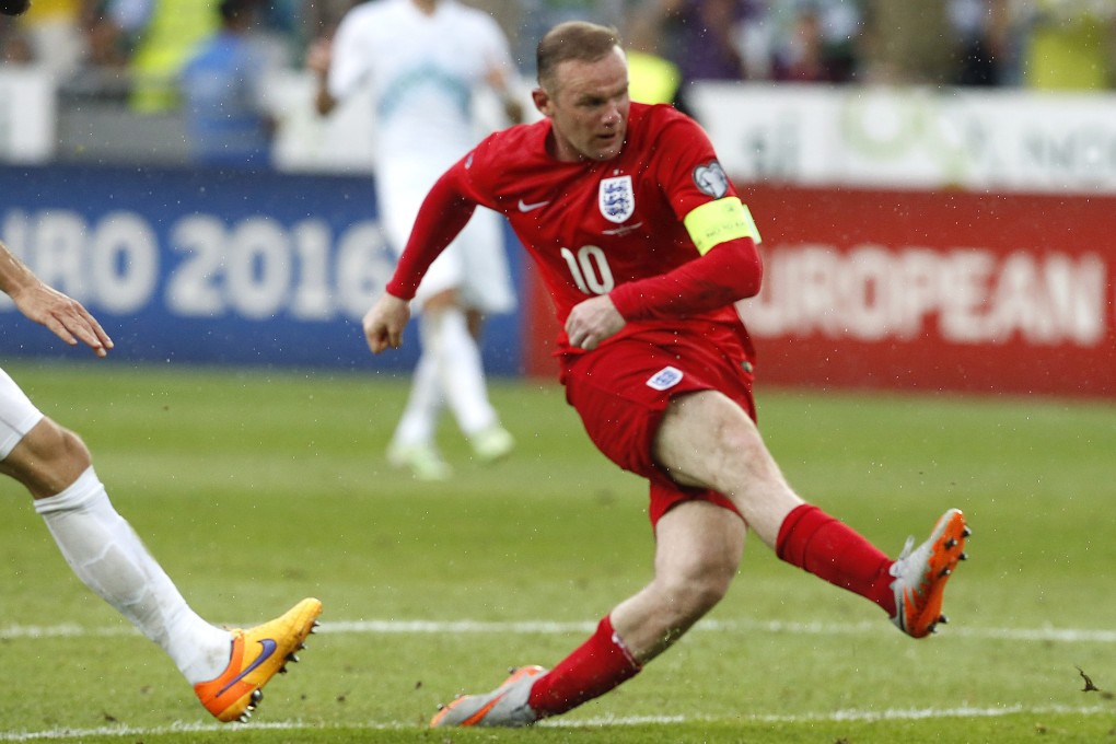 Wayne Rooney fires at the Slovenian goal. Photo: EPA